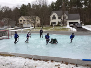 Backyard rink hockey game