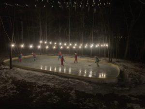Backyard rink at night