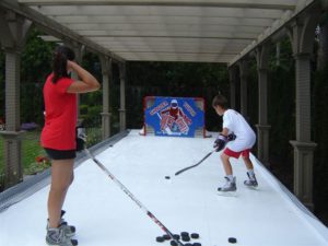 Outdoor synthetic ice pad