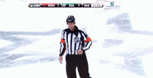 Referee helping players and coaches learn life lessons in hockey