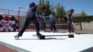 Kids playing on Hockeyshot synthetic ice tiles from the Revolution line